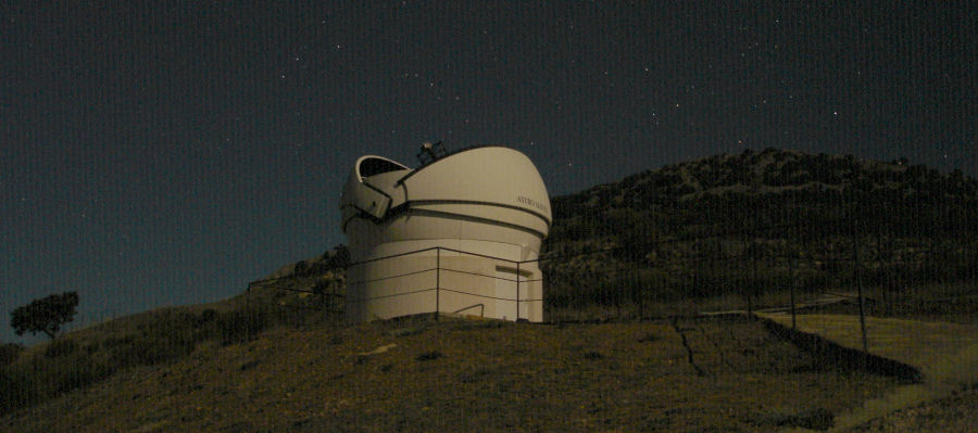 One of the LSSS telescopes by night, scanning the sky for Near-Earth Objects.